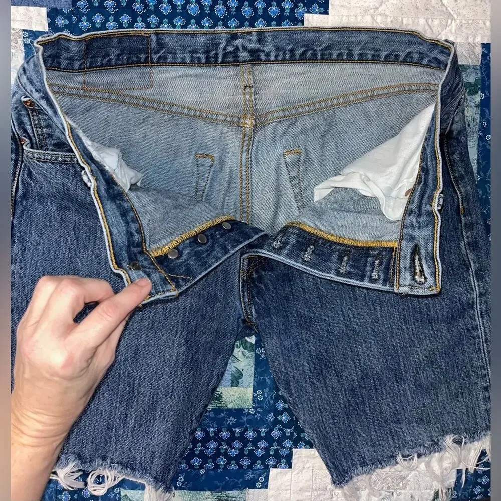 Vintage Levi's 501 cut-off denim shorts with a button fly and frayed hem